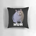 Huh?" cat meme printed on a soft, plush throw pillow for a touch of whimsical cat humor in your home.