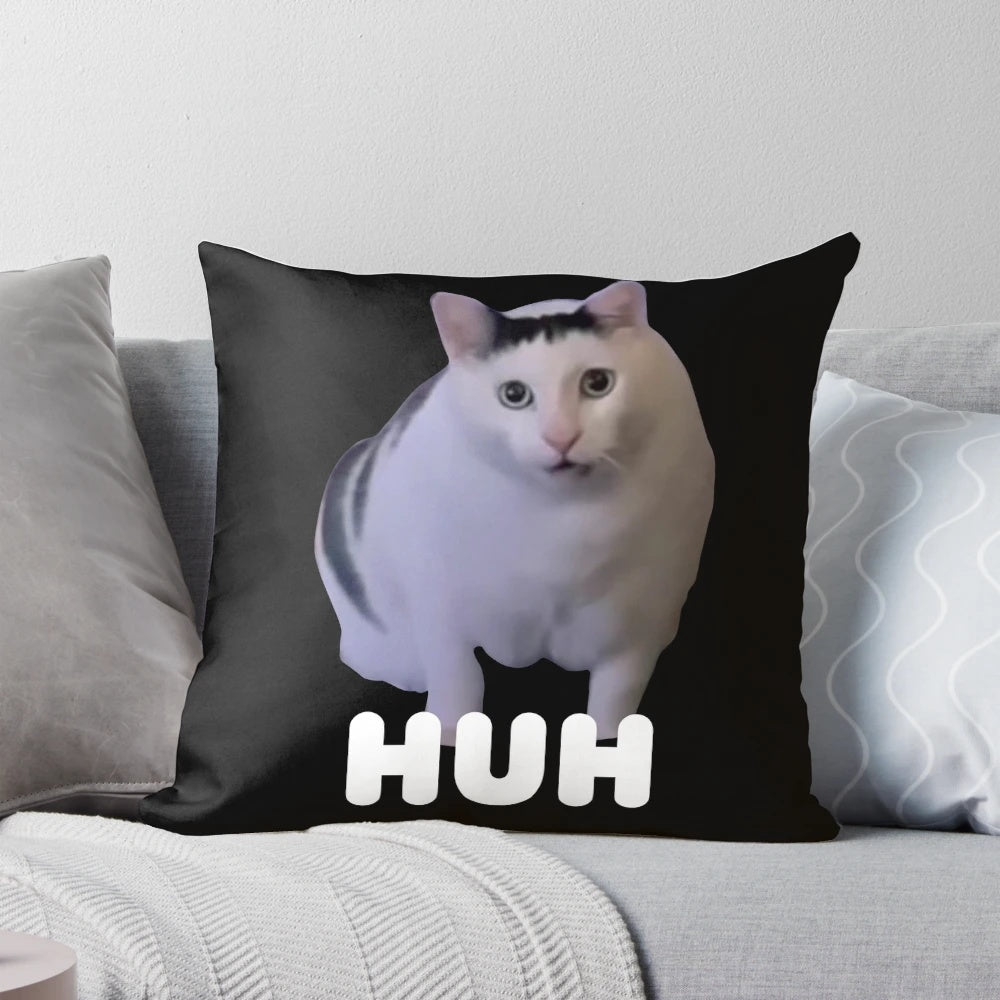 Huh?" cat meme printed on a soft, plush throw pillow for a touch of whimsical cat humor in your home.