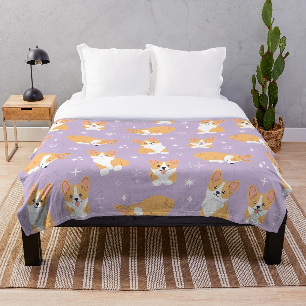 Jolly corgis in a cute and colorful pattern on a purple plush blanket