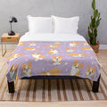 Jolly corgis in a cute and colorful pattern on a purple plush blanket