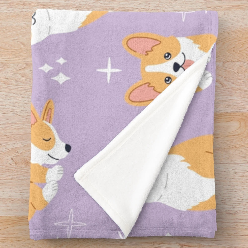Jolly corgis in a cute and colorful pattern on a purple plush blanket