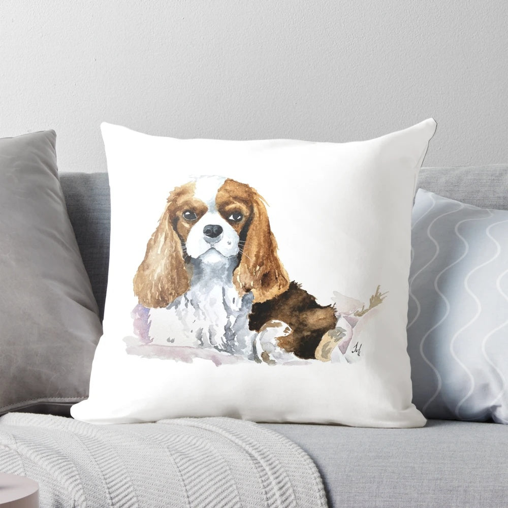 Charming King Charles Cavalier puppy on a soft, plush pillow