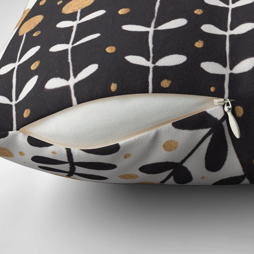 Colorful kitten pillow with capes in a floral pattern.