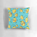 A colorful, cartoon-style throw pillow featuring cute lemon faces in a fun, vibrant pattern.