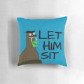 Photograph of a plush, decorative pillow shaped like a sea lion, with the text "Let Gerald Sit" printed on it.
