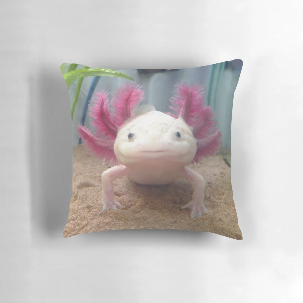 Soft, plush pillow featuring a detailed illustration of a cute, smiling leucistic axolotl amphibian.