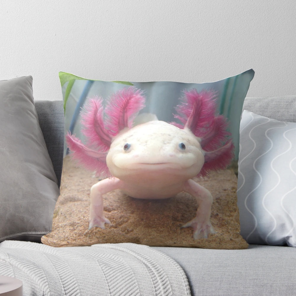 Soft, plush pillow featuring a detailed illustration of a cute, smiling leucistic axolotl amphibian.