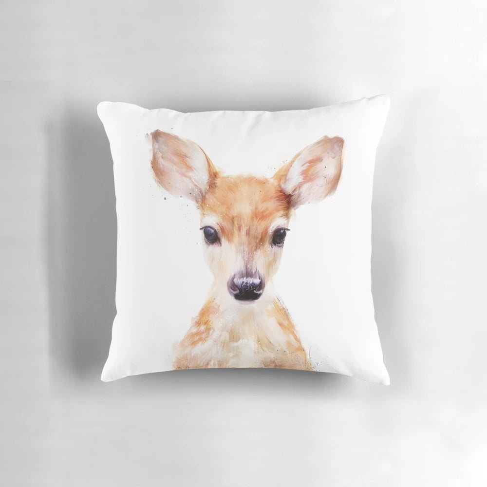A small, soft plush pillow in the shape of a cute little deer, perfect for nature and wildlife enthusiasts.
