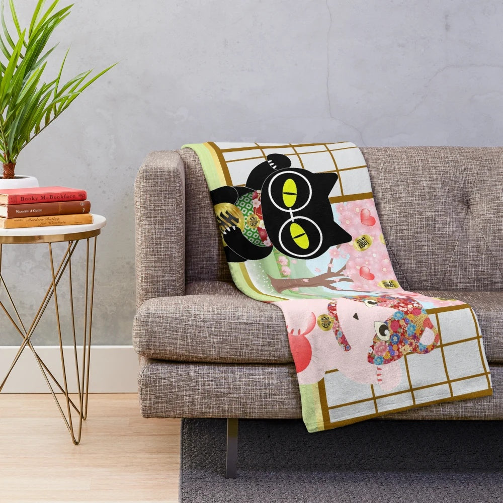 Maneki Neko plush blanket with a cute lucky cat design