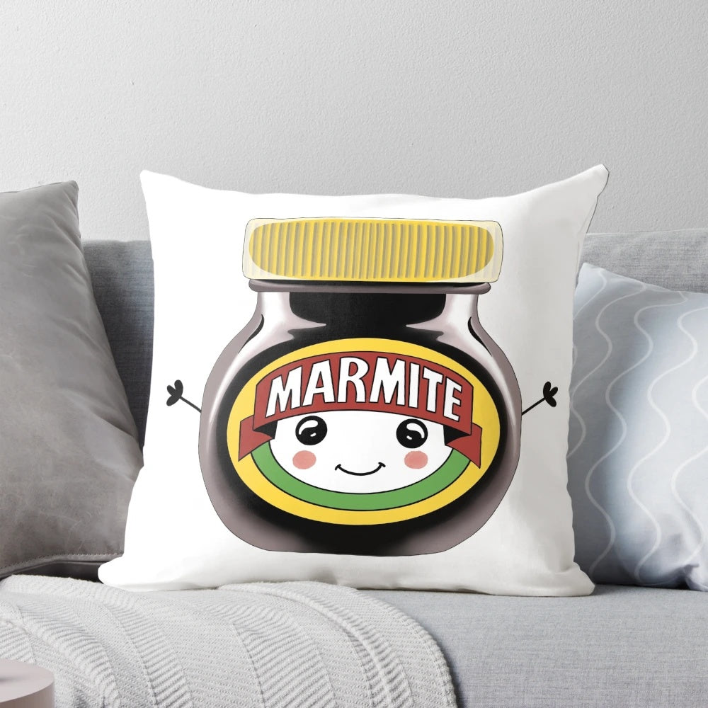 Soft, plush pillow featuring a cute, anthropomorphic Marmite jar with a smiley face, designed by Theodora Gould.