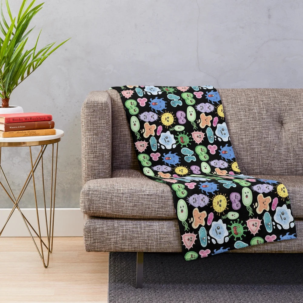 Cute microbes, bacteria, and viruses on a plush blanket