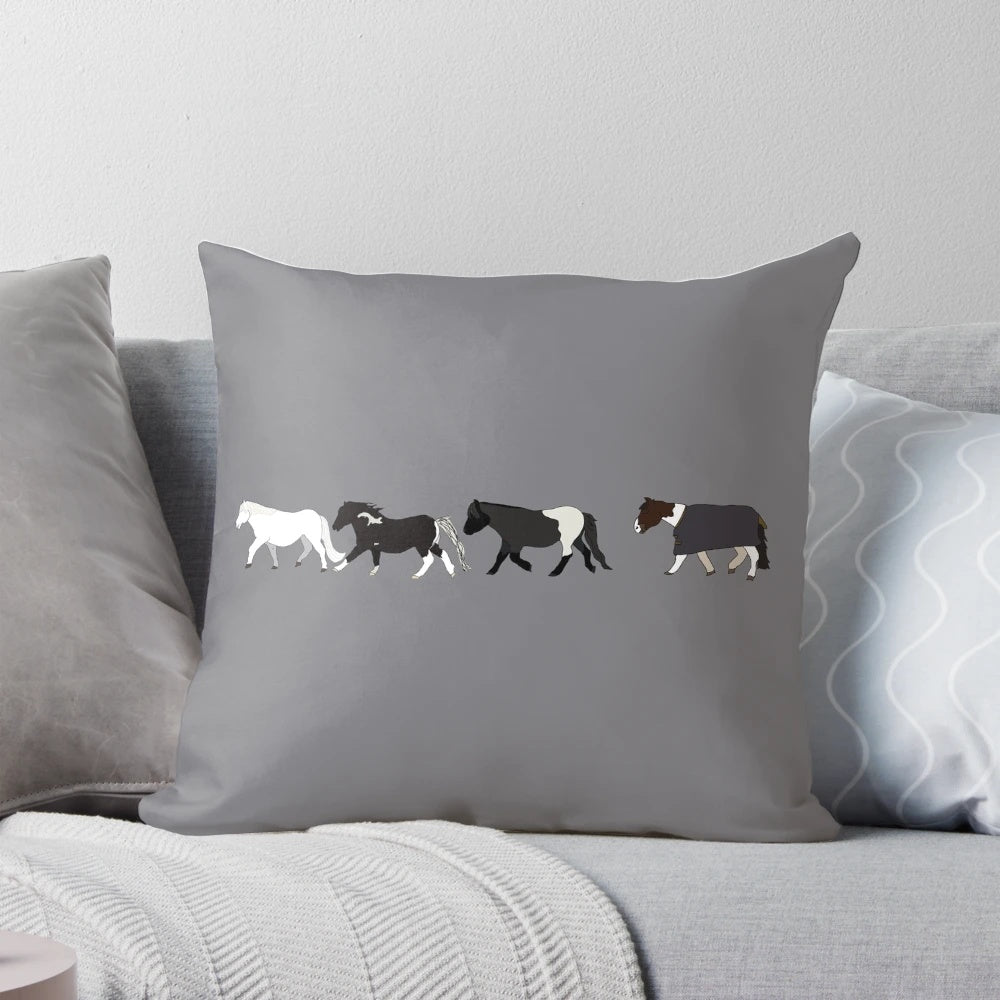 A plush, mini parade pillow featuring a design of small, playful horses.