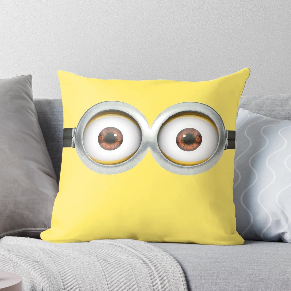 Plush minion-themed pillow with eyes design