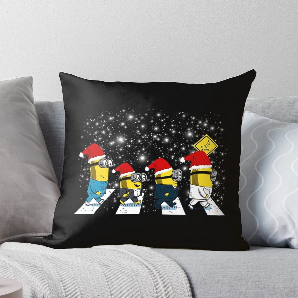 Plush minions walk in Christmas-themed pillow
