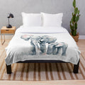 Soft and cozy grey elephant plush blanket featuring a watercolor design of a mother and baby elephant