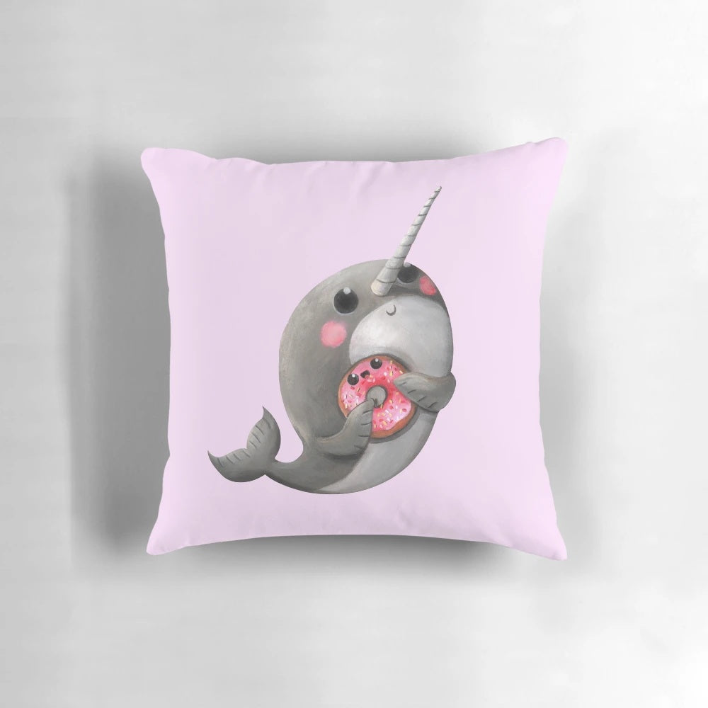 Cute plush narwhal with donut throw pillow, perfect for decorating a child's room or nursery.