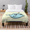 Soft and cuddly narwhal plush blanket in a blue shade