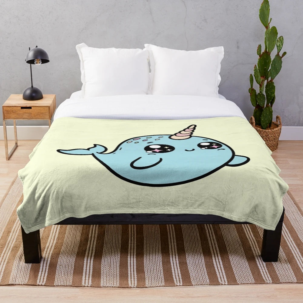 Soft and cuddly narwhal plush blanket in a blue shade