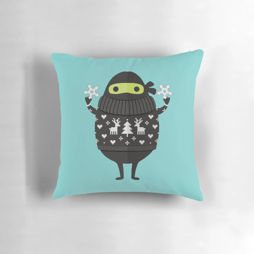 Cute cartoon illustration of Ninjacado, the avocado ninja, wearing an ugly holiday sweater on a plush decorative pillow.