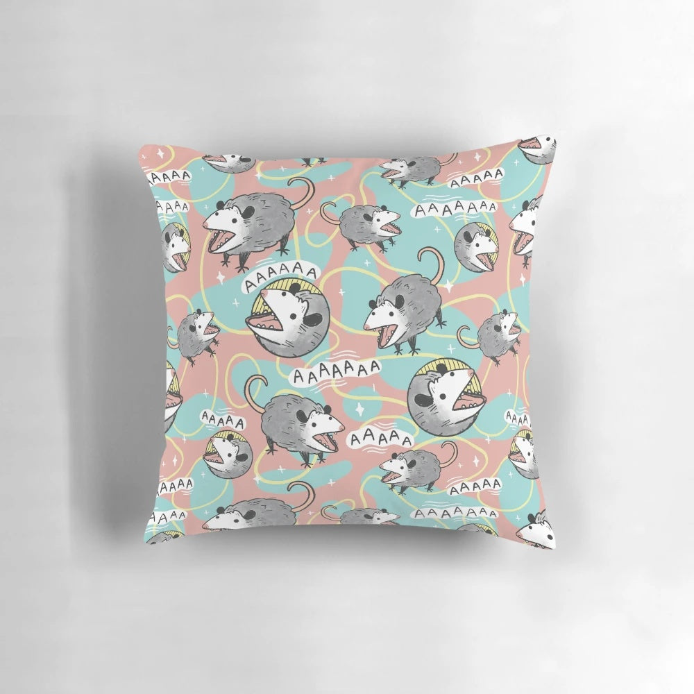 Cute and whimsical opossum pillow with a screaming expression, perfect for adding a touch of retro-inspired nature decor to your home.