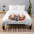 Soft and cozy orange tabby cat plush blanket featuring autumn-themed illustrations