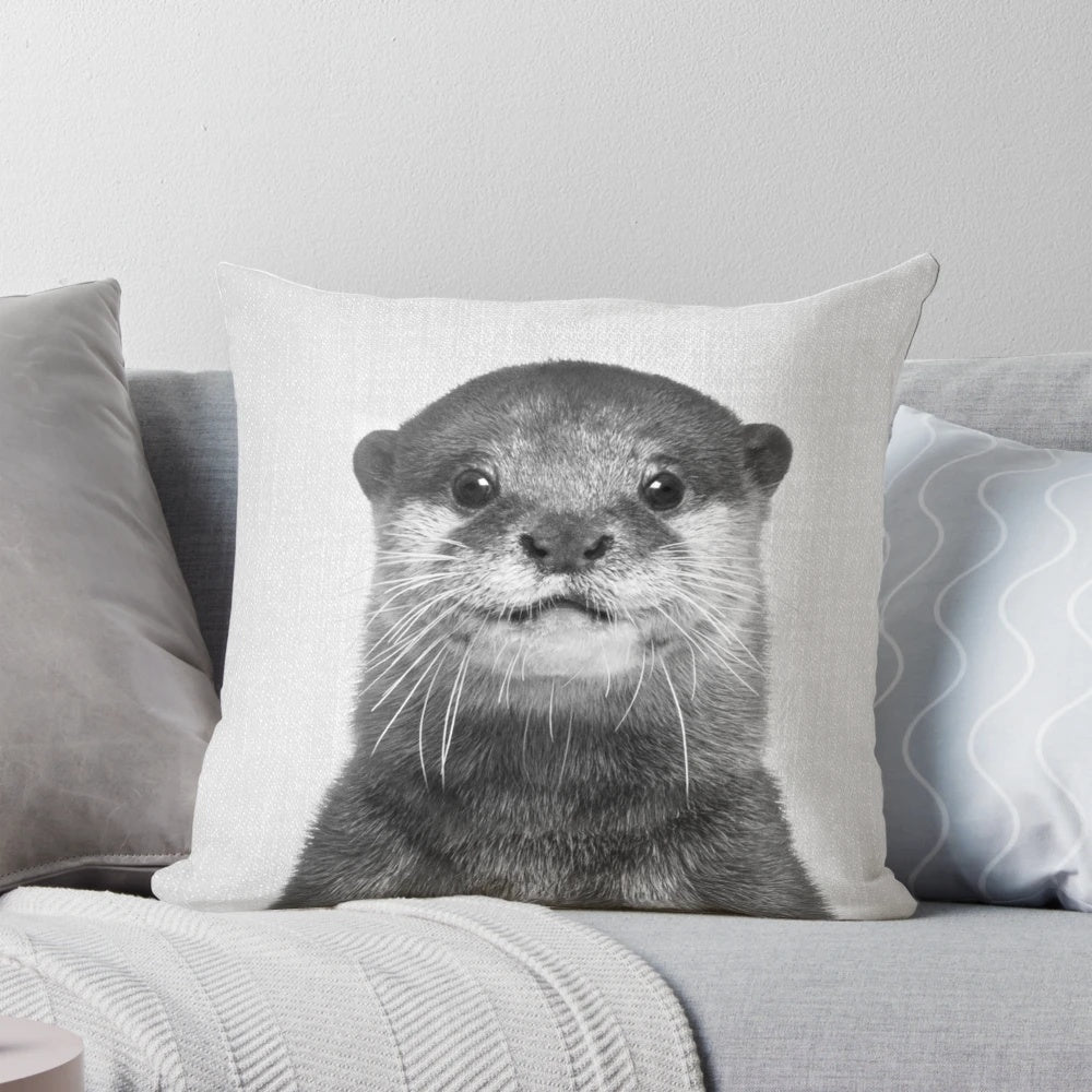 Otter black and white decorative pillow with nature and wildlife design