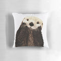 Soft, plush pillow featuring a playful otter with a big smile, perfect for adding a touch of whimsy to any room.