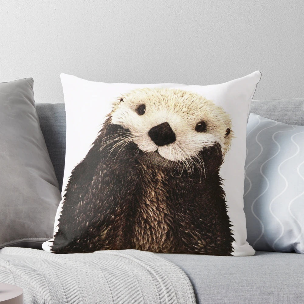 Soft, plush pillow featuring a playful otter with a big smile, perfect for adding a touch of whimsy to any room.