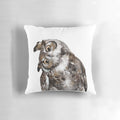 Soft, plush owl-shaped pillow in neutral colors for a natural, woodland-inspired look.