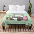 Cute panda character with headphones and gaming accessories on a soft plush blanket