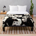 Soft and huggable panda plush blanket for animal lovers