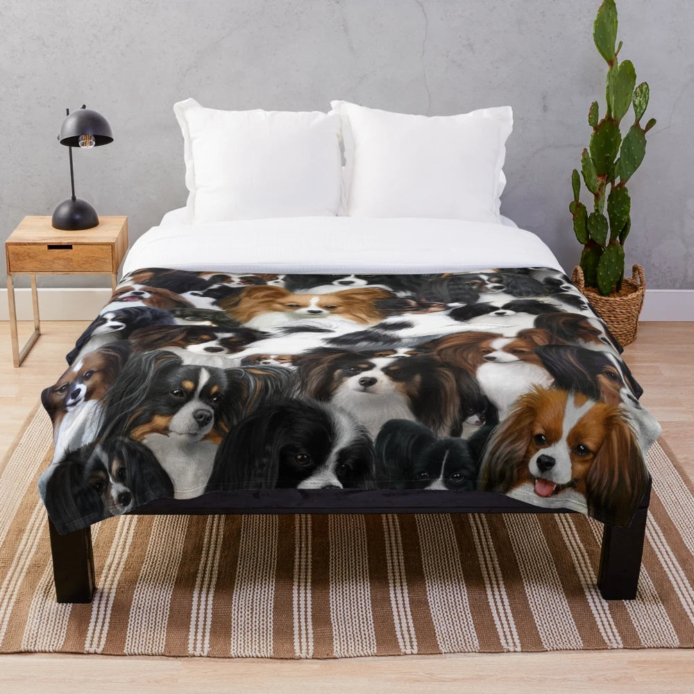 Papillon and Phalene dog collage on a soft, plush blanket