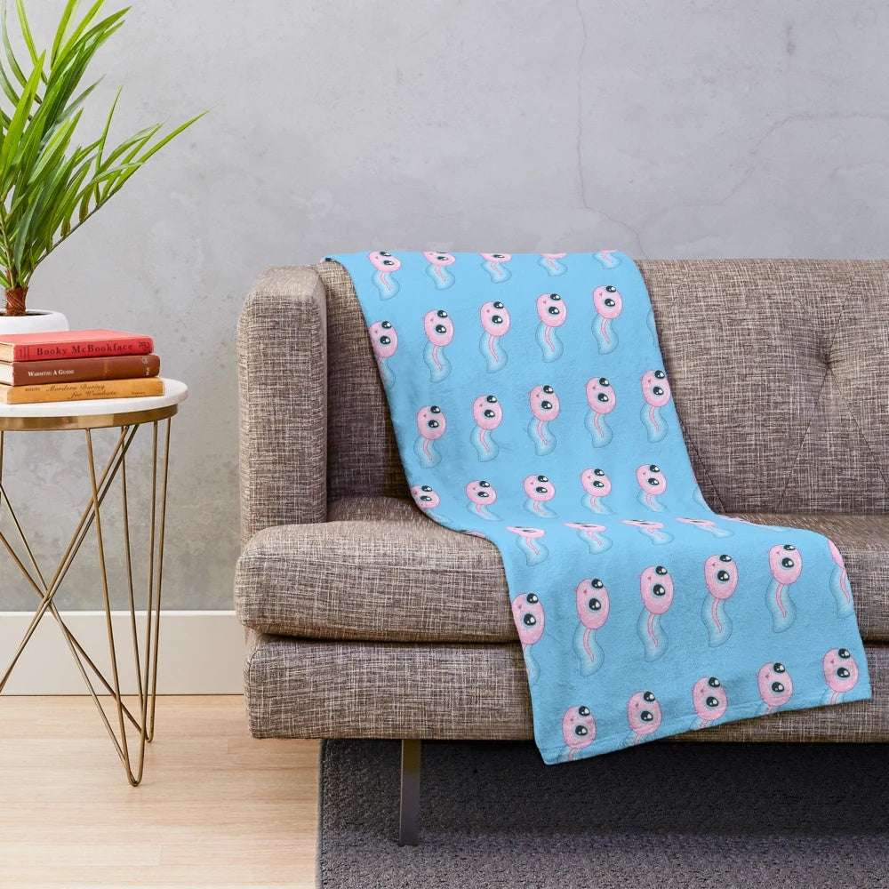 Pastel-colored plush blanket featuring a cute frog pattern
