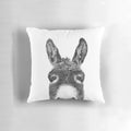 Soft, black and white pillow with a playful donkey peeking out