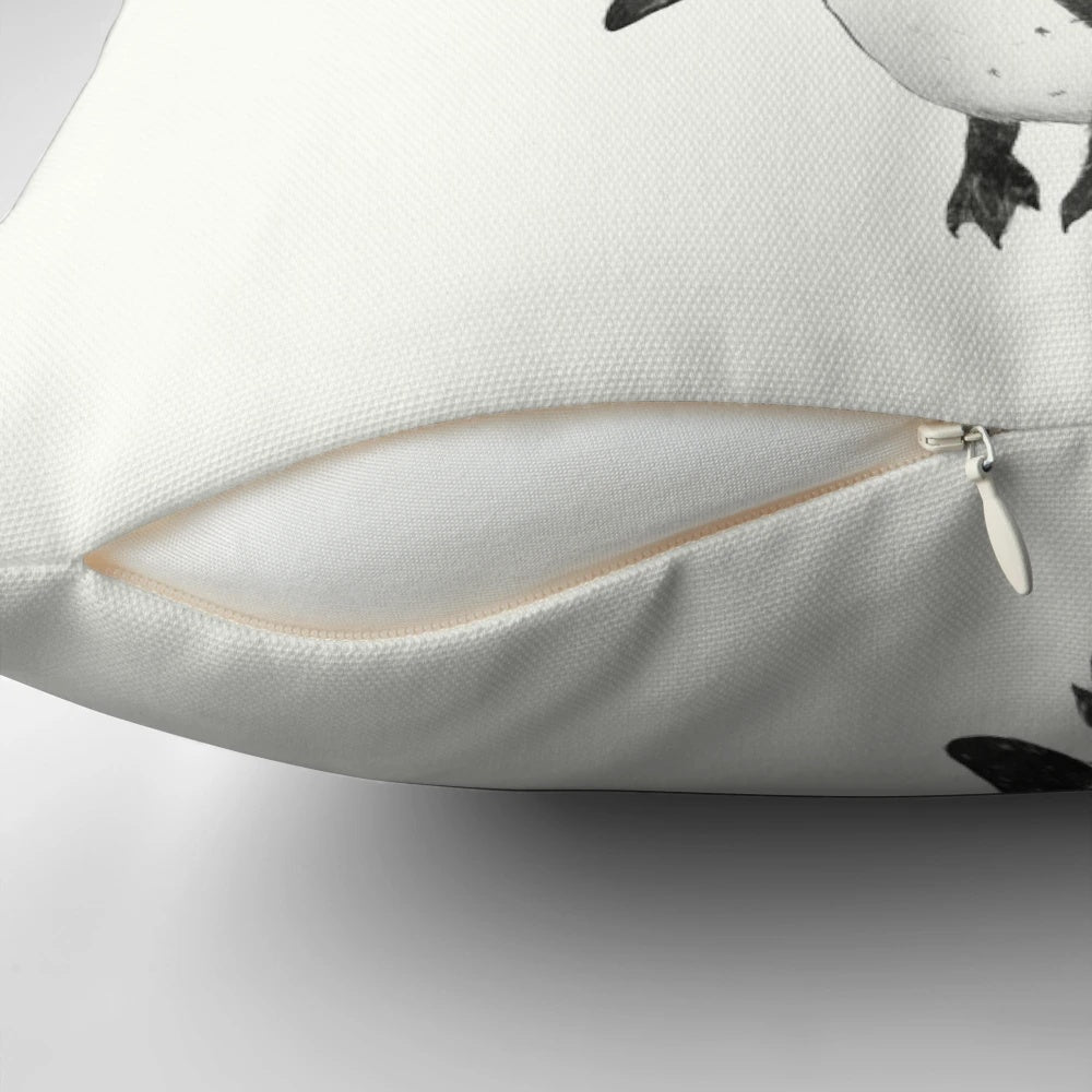 Soft, plush penguin-shaped pillow in black, white and pink with a whimsical balloon design, perfect for a baby nursery or child's bedroom.