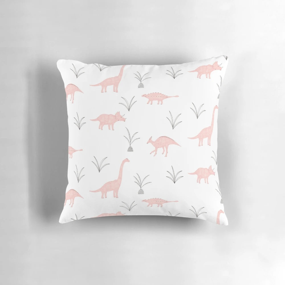 A fluffy pink pillow with a charming dinosaur print, perfect for adding a touch of whimsy to any space.