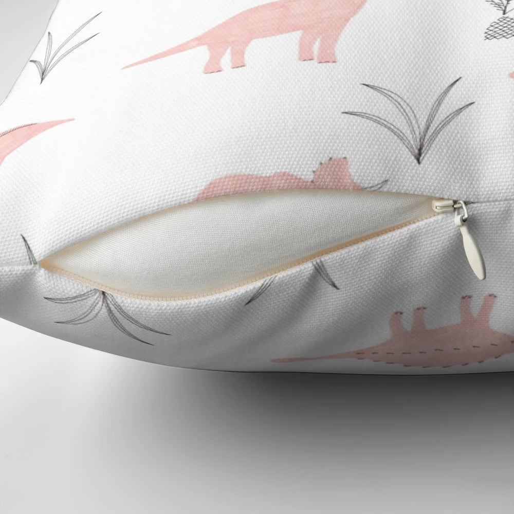 A fluffy pink pillow with a charming dinosaur print, perfect for adding a touch of whimsy to any space.