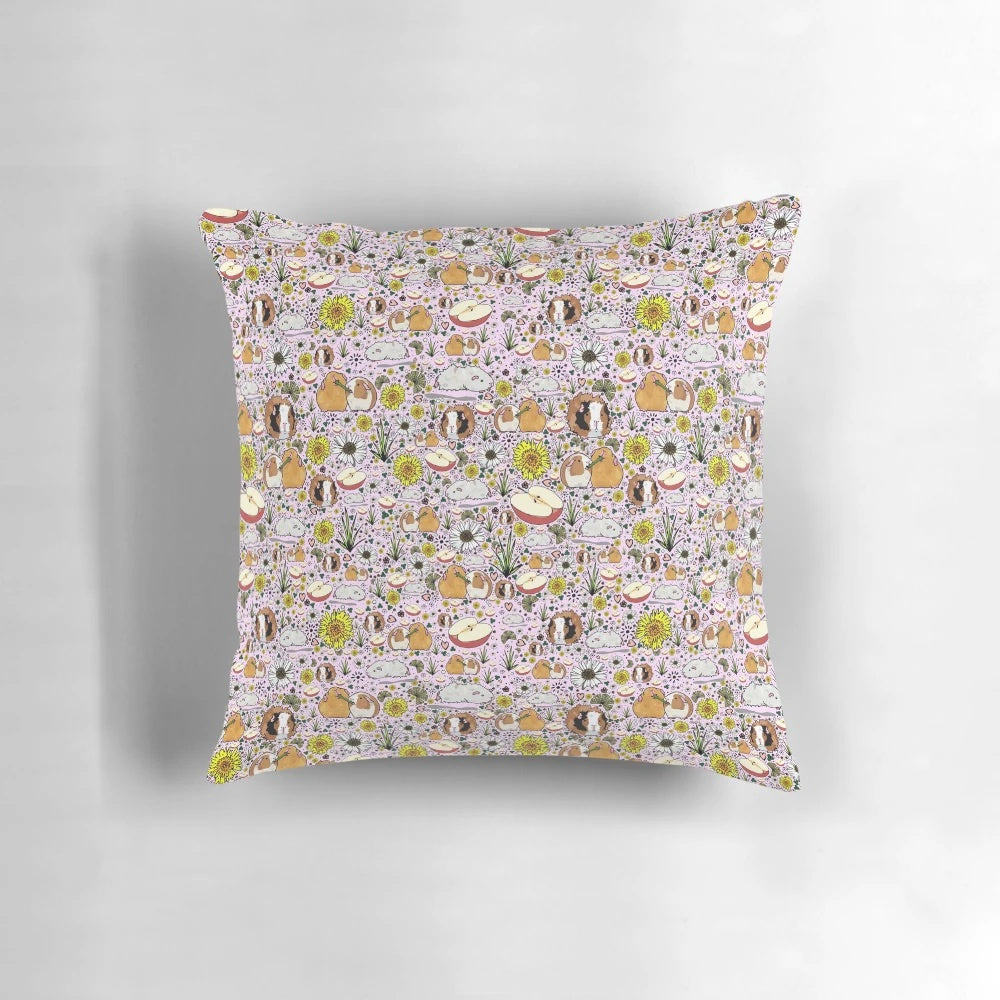 A soft, plush pillow featuring a charming guinea pig design in shades of pink.