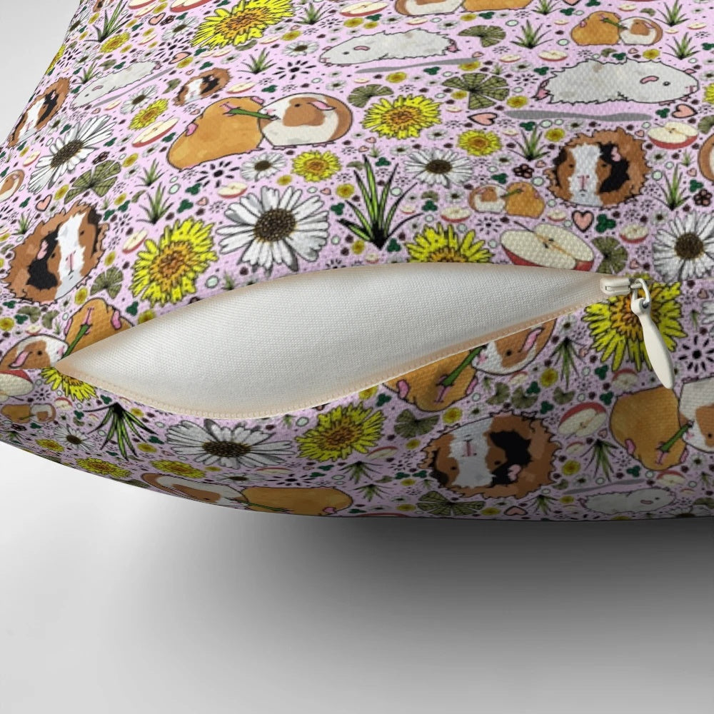 A soft, plush pillow featuring a charming guinea pig design in shades of pink.