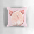 A soft, plush pink pillow in the shape of a cute piglet with a curly tail