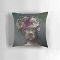 A tater tot-shaped pillow featuring a pit bull wearing a beautiful flower crown