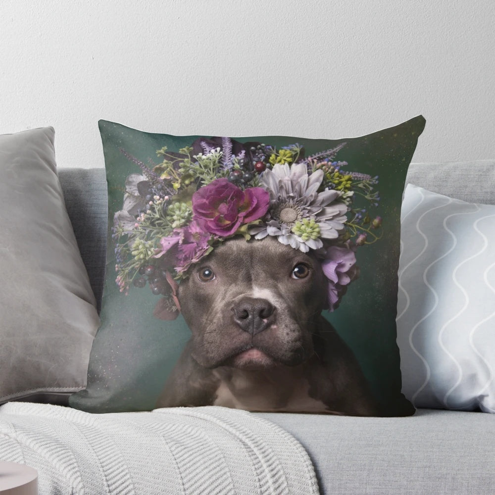 A tater tot-shaped pillow featuring a pit bull wearing a beautiful flower crown