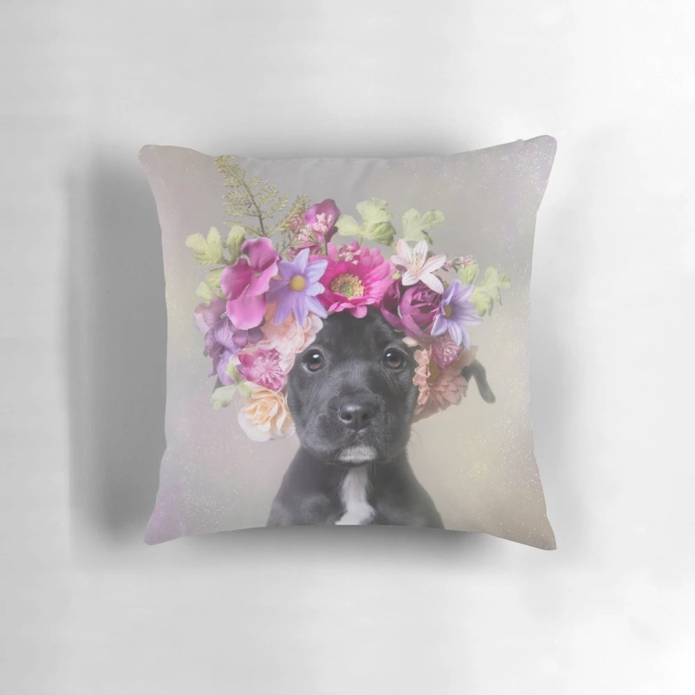 Pit bull puppy wearing a flower crown on a throw pillow