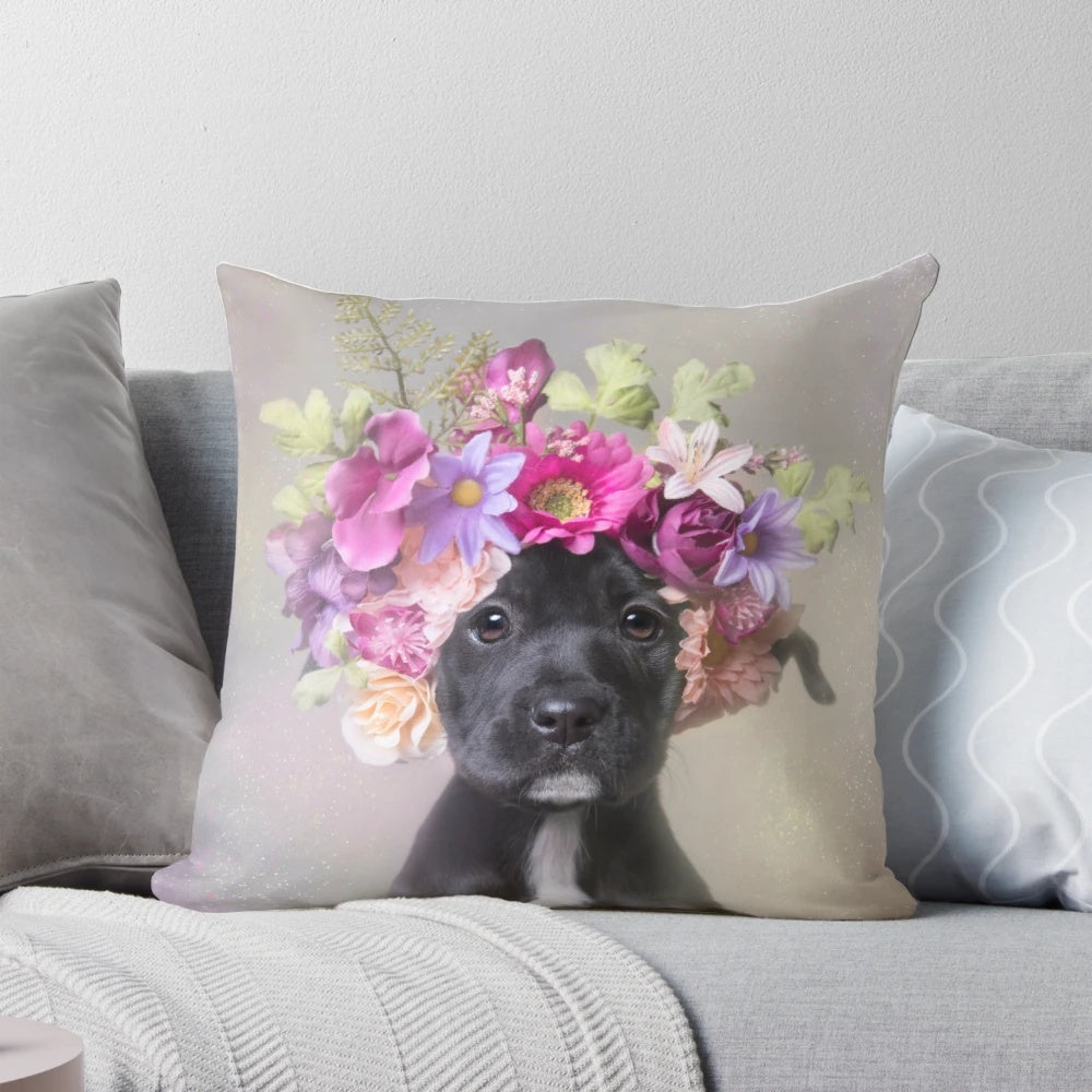 Pit bull puppy wearing a flower crown on a throw pillow