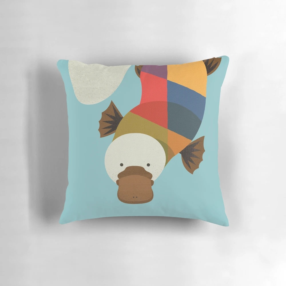 Whimsical platypus-themed decorative pillow with geometric patterns, perfect for a nature-inspired nursery or child's room.