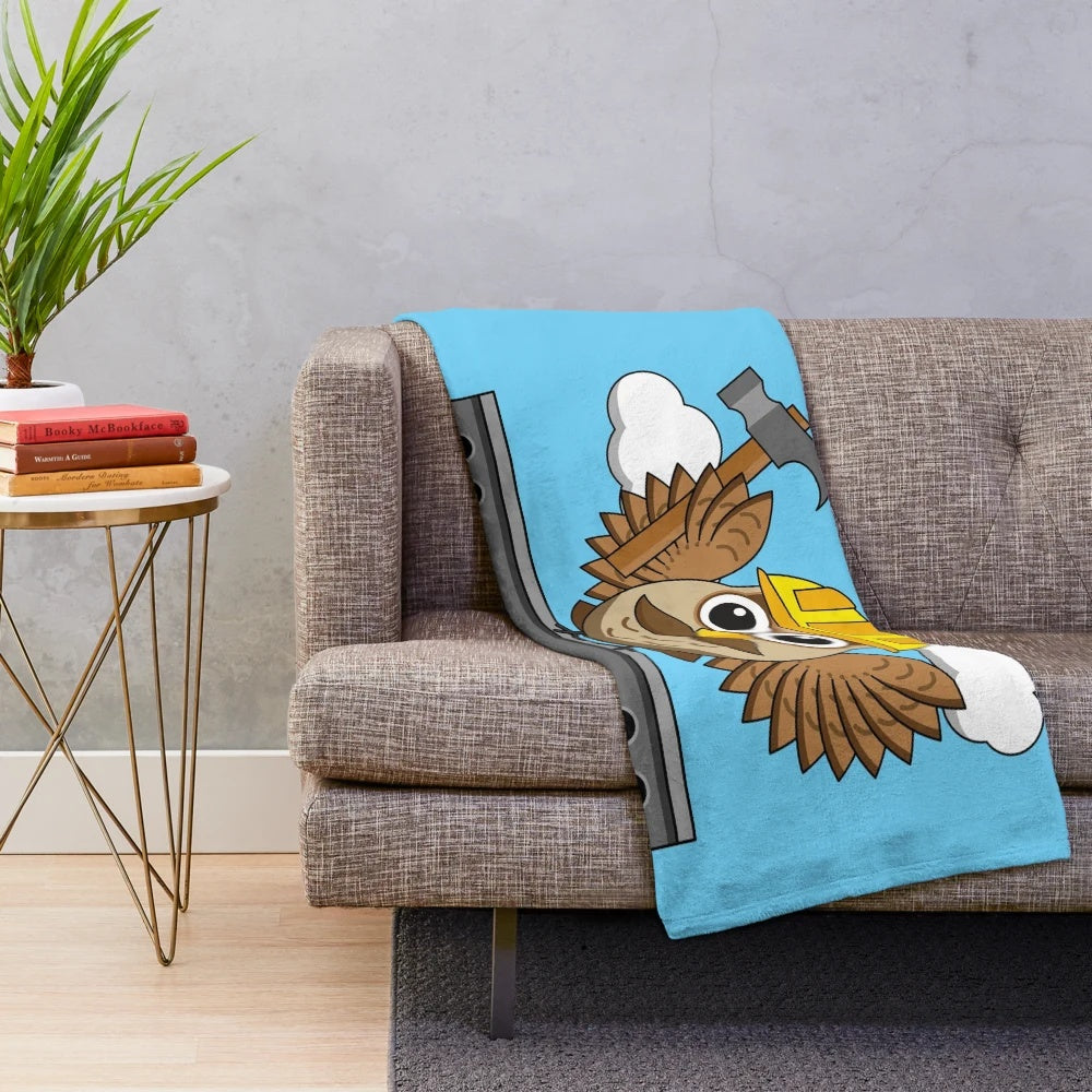 Cute cartoon construction worker owl wearing hard hat on plush blanket
