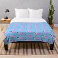 Soft and cuddly plush tadpole blanket for a whimsical touch