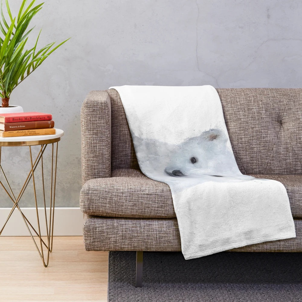 Polar bear plush blanket in a winter scene