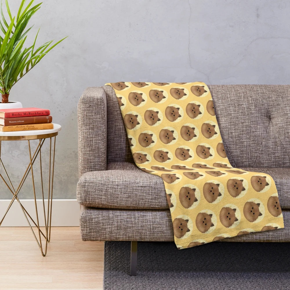 Cute pomchi dog portrait on a plush blanket