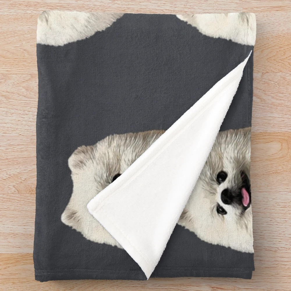 Soft and cozy plush blanket featuring a cute white pomeranian puppy design